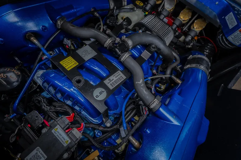 Slide: The Image of 2021 MasterCraft X24 engine, 6.2L Ilmor, detailed view with blue components. - 48