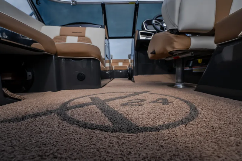 Slide: The Image of Interior view of 2021 MasterCraft X24 boat with logo on carpet flooring. - 30