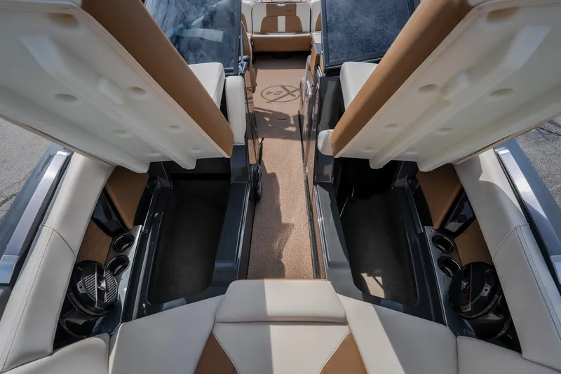 Slide: The Image of 2021 MasterCraft X24 boat interior with open storage compartments and luxurious seating. - 40