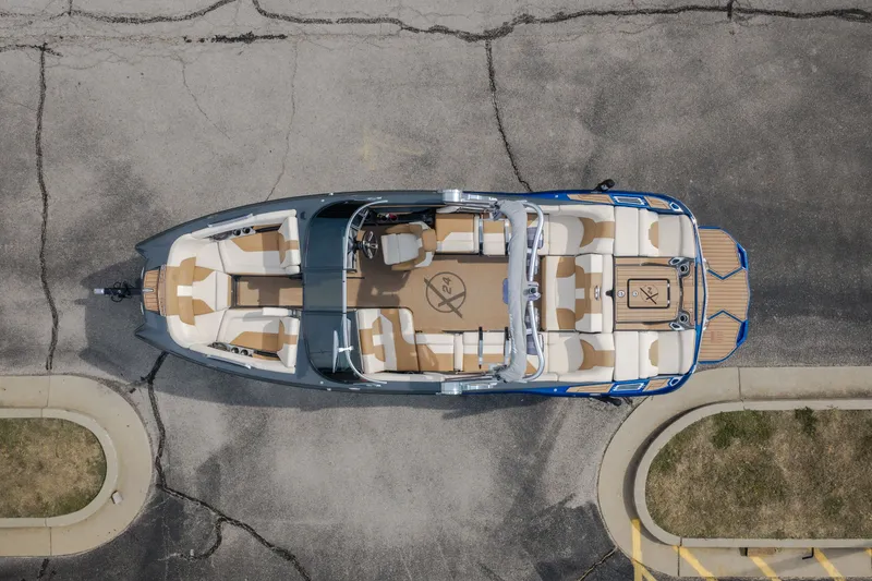 Slide: The Image of Overhead view of a 2021 MasterCraft X24 boat with spacious seating and sleek design. - 59