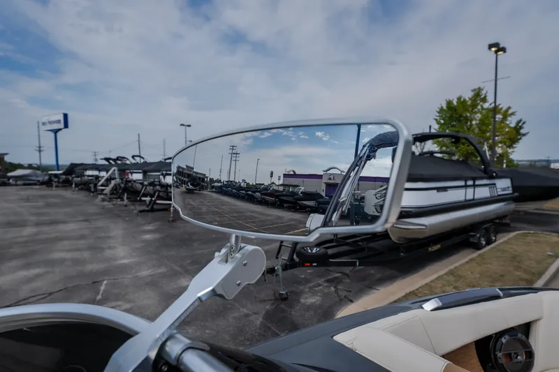 Slide: The Image of Reflection of boats in a side mirror, featuring a 2021 MasterCraft X24. - 35