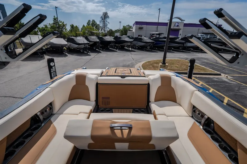 Slide: The Image of Luxurious interior of 2021 MasterCraft X24 boat with plush seating and cup holders. - 46