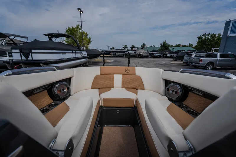 Slide: The Image of Luxurious interior of 2021 MasterCraft X24 boat with plush seating and speakers. - 36