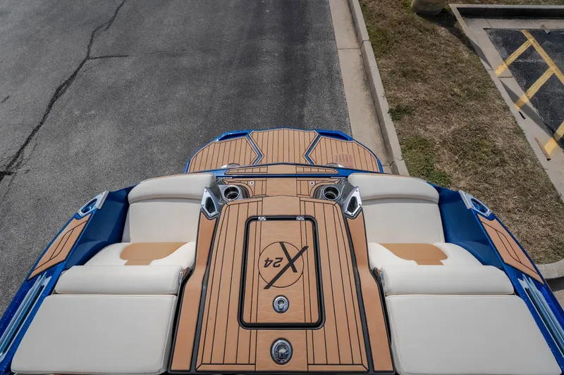 Slide: The Image of 2021 MasterCraft X24 boat with sleek deck design and comfortable seating. - 50