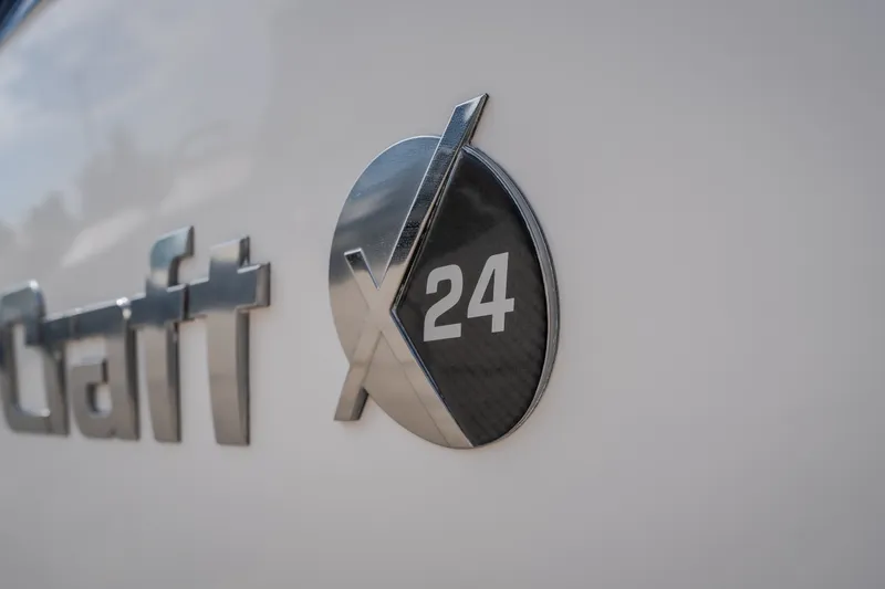 Slide: The Image of 2021 MasterCraft X24 logo on boat exterior. - 6