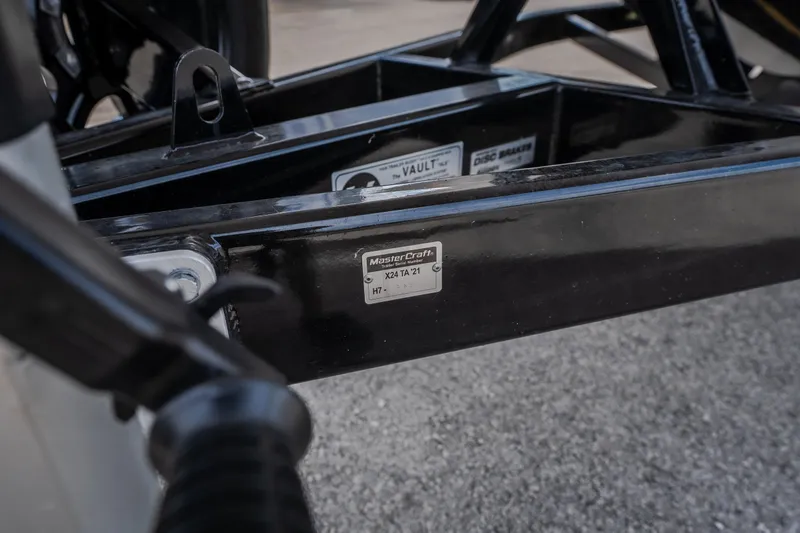 Slide: The Image of 2021 MasterCraft X24 trailer frame with identification plate, close-up view. - 52