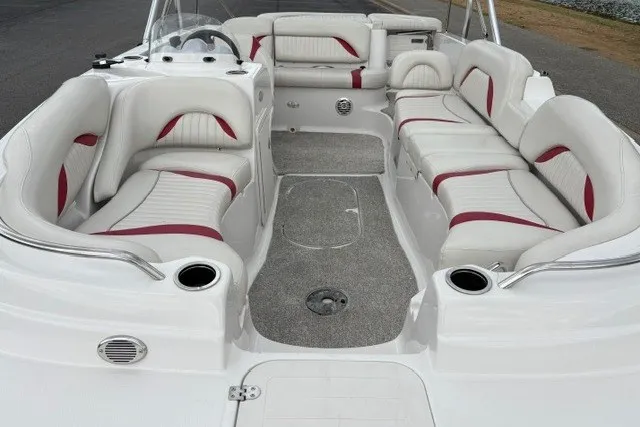 Slide: The Image of 2012 Starcraft 2000 IO Limited boat interior with white and red seating, spacious layout. - 32