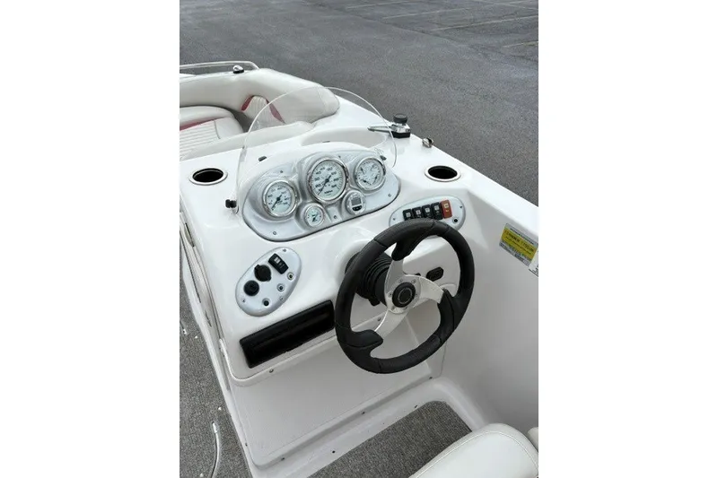 Slide: The Image of Steering console of a 2012 Starcraft 2000 IO Limited boat with gauges and controls. - 30