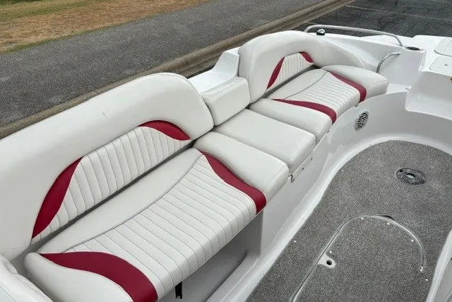Slide: The Image of 2012 Starcraft 2000 IO Limited boat interior with white and red seating. - 20