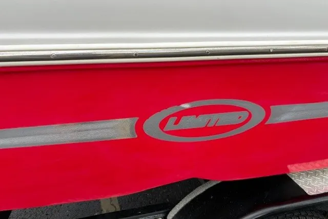 Slide: The Image of Red and white Starcraft 2000 IO Limited boat, 2012 model, with "Limited" logo. - 27