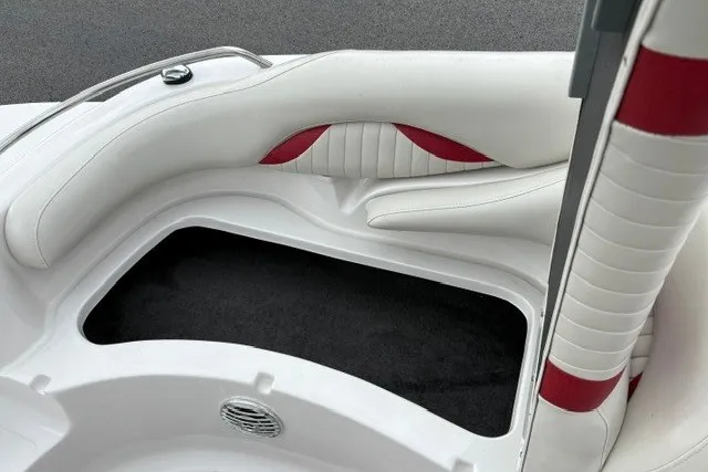 Slide: The Image of Interior of 2012 Starcraft 2000 IO Limited boat with white and red seating. - 16