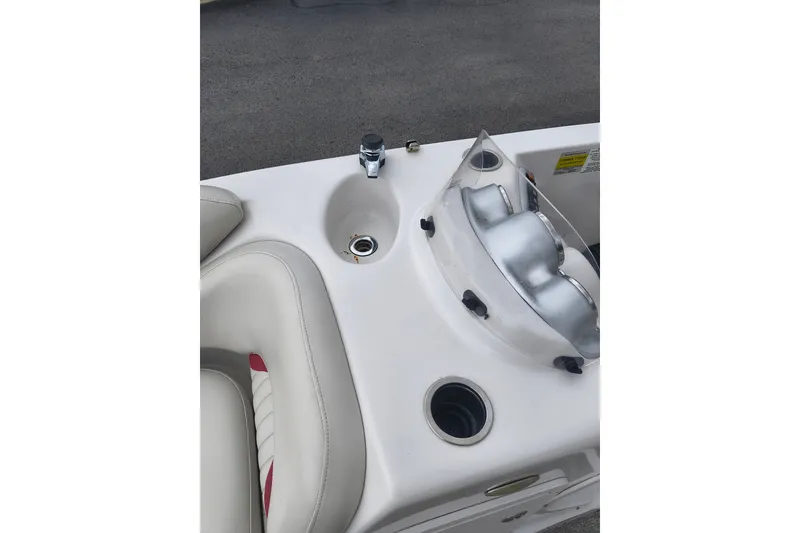 Slide: The Image of Interior view of a 2012 Starcraft 2000 IO Limited boat, featuring seating and controls. - 42