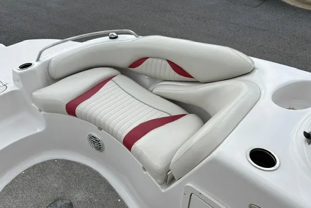 Slide: The Image of Luxurious seating on a 2012 Starcraft 2000 IO Limited boat with red and white upholstery. - 22