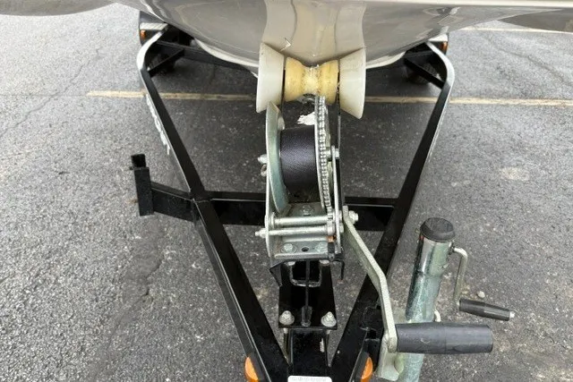 Slide: The Image of Trailer hitch of a 2012 Starcraft 2000 IO Limited boat on pavement. - 25