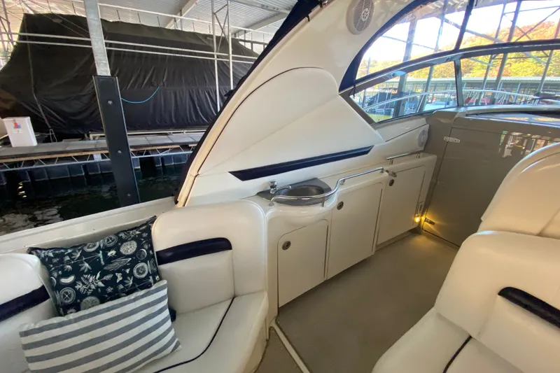 Slide: The Image of Interior of 2006 Sea Ray 38 Sundancer yacht with seating and cabinetry. - 10