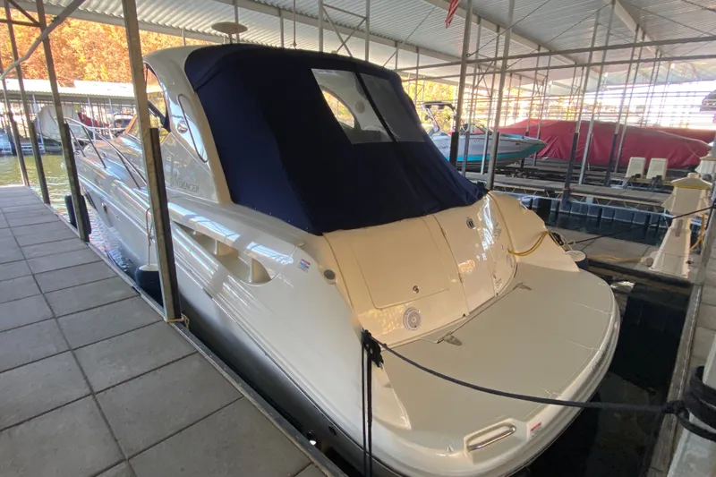 Slide: The Image of 2006 Sea Ray 38 Sundancer yacht docked in a covered marina. - 51