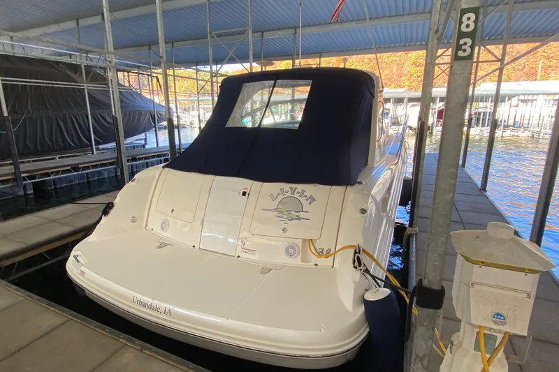 Slide: The Image of 2006 Sea Ray 38 Sundancer docked in a covered marina slip. - 49