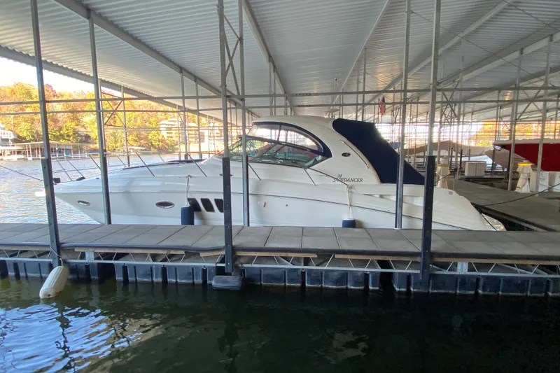 Slide: The Image of 2006 Sea Ray 38 Sundancer yacht docked under covered marina. - 52