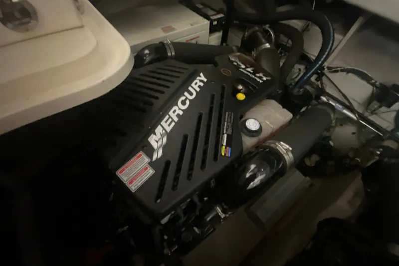 Slide: The Image of Engine compartment of a 2006 Sea Ray 38 Sundancer with Mercury engine. - 44