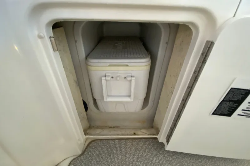 Slide: The Image of Storage compartment with cooler on a 2006 Sea Ray 38 Sundancer boat. - 11