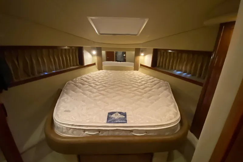 Slide: The Image of Interior cabin of 2006 Sea Ray 38 Sundancer with a comfortable bed. - 30
