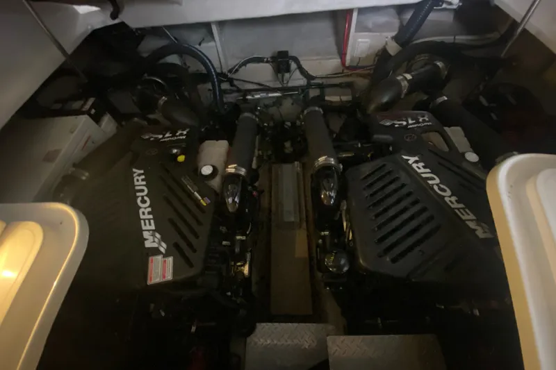 Slide: The Image of Engine room of a 2006 Sea Ray 38 Sundancer with twin Mercury engines. - 45
