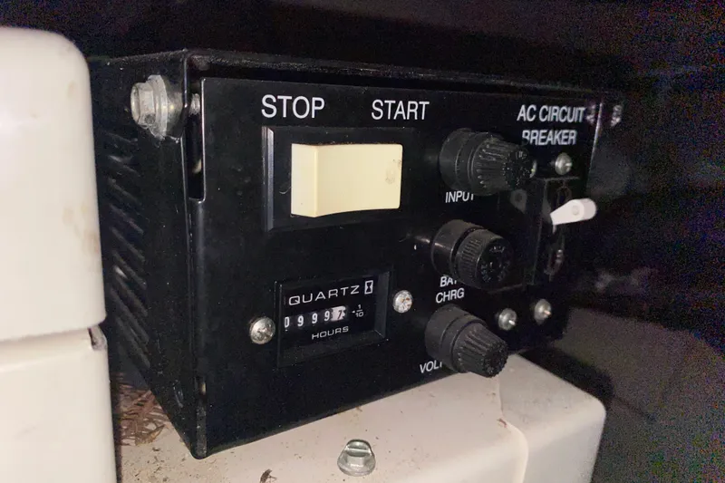 Slide: The Image of Control panel with stop/start switch and hour meter on 2006 Sea Ray 38 Sundancer. - 46