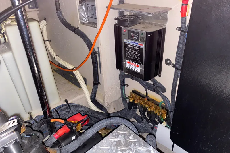 Slide: The Image of Engine room of 2006 Sea Ray 38 Sundancer with electrical components and wiring. - 43