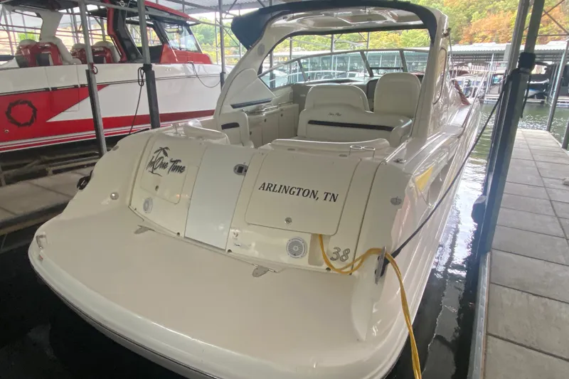 Slide: The Image of 2006 Sea Ray 38 Sundancer docked, featuring Arlington, TN registration. - 8