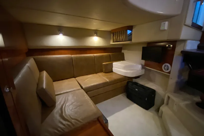 Slide: The Image of Interior of 2006 Sea Ray 38 Sundancer yacht with leather seating and ambient lighting. - 37