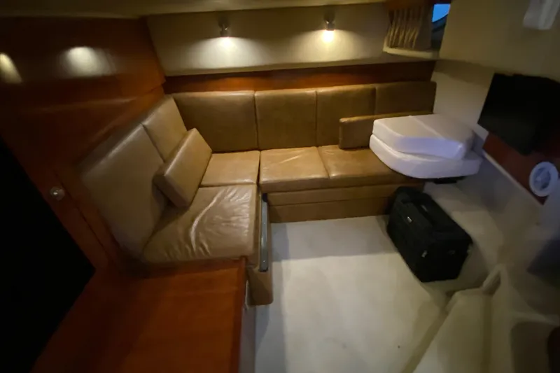 Slide: The Image of Luxurious interior of 2006 Sea Ray 38 Sundancer with leather seating and ambient lighting. - 36