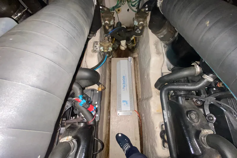 Slide: The Image of Engine compartment of a 2006 Sea Ray 38 Sundancer boat, showcasing mechanical components. - 40