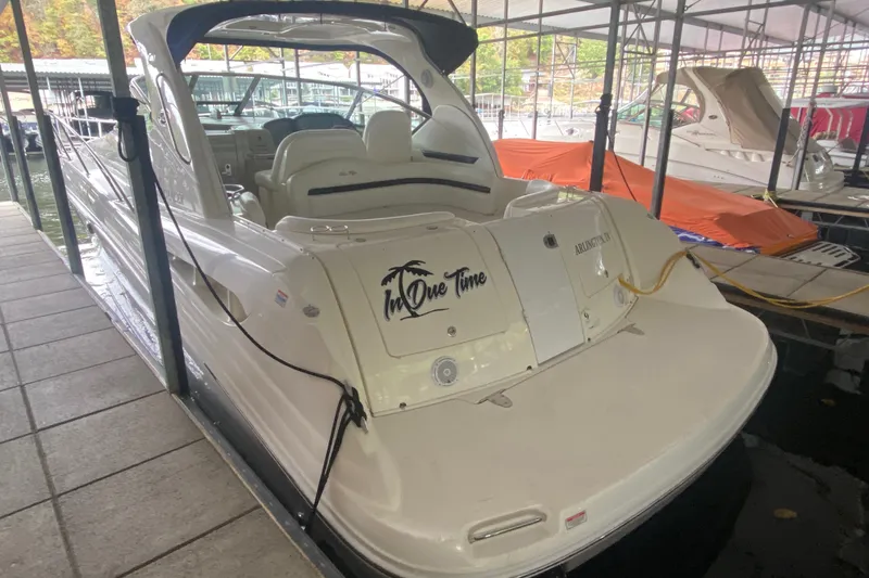 Slide: The Image of 2006 Sea Ray 38 Sundancer docked, featuring spacious seating and sleek design. - 9