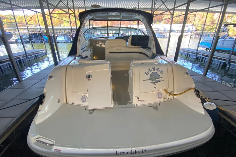 Slide: The Image of 2006 Sea Ray 38 Sundancer docked in a marina, rear view. - 6