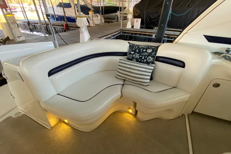 Slide: The Image of Luxurious seating area on a 2006 Sea Ray 38 Sundancer yacht with decorative pillows. - 9