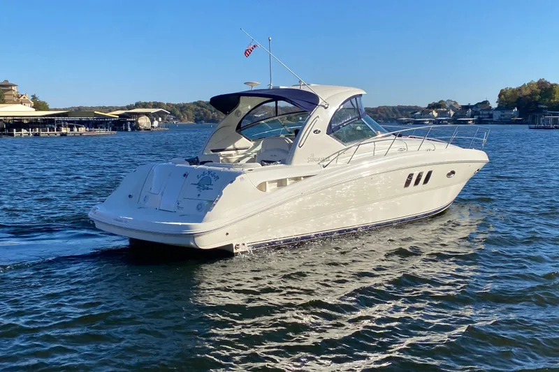 Slide: The Image of 2006 Sea Ray 38 Sundancer yacht cruising on a sunny lake. - 3