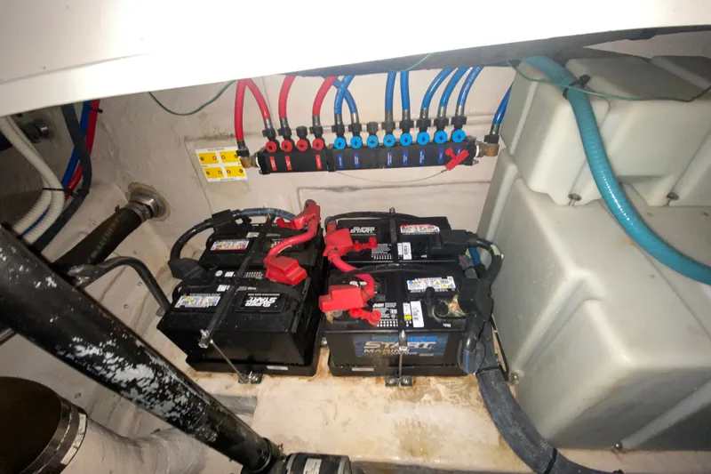 Slide: The Image of Engine compartment of a 2006 Sea Ray 38 Sundancer with batteries and wiring. - 41
