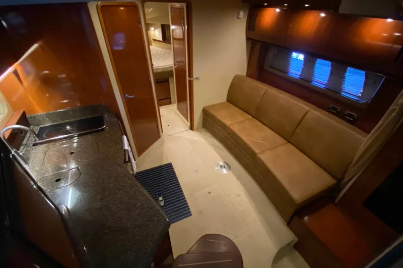 Slide: The Image of Interior of 2006 Sea Ray 38 Sundancer yacht with kitchen and seating area. - 20