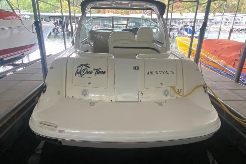 Slide: The Image of 2006 Sea Ray 38 Sundancer docked, rear view with "In Due Time" and "Arlington, TN" text. - 10