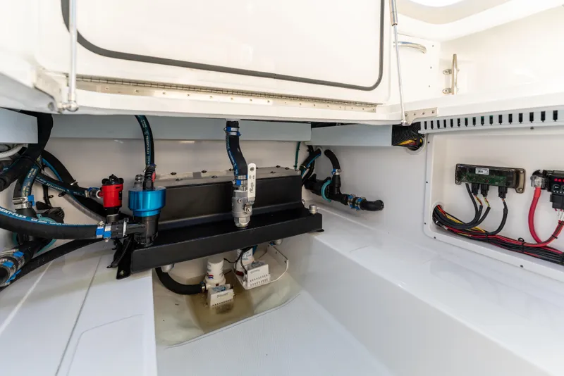 Slide: The Image of 2025 Mag Bay 43 CC boat engine compartment with wiring and components. - 27