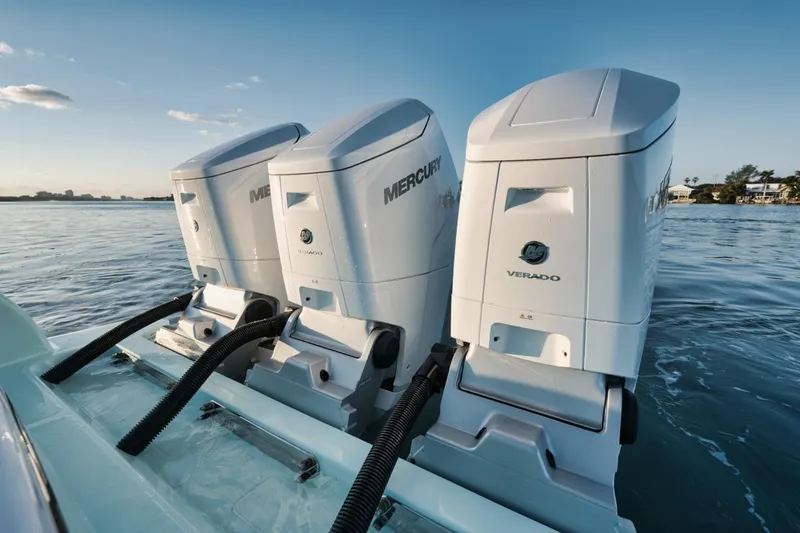 Slide: The Image of Triple Mercury Verado outboard engines on a 2025 Mag Bay 43 CC boat. - 21