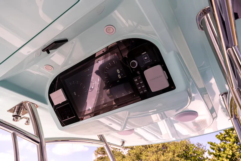 Slide: The Image of 2025 Mag Bay 43 CC boat dashboard with modern navigation equipment. - 11