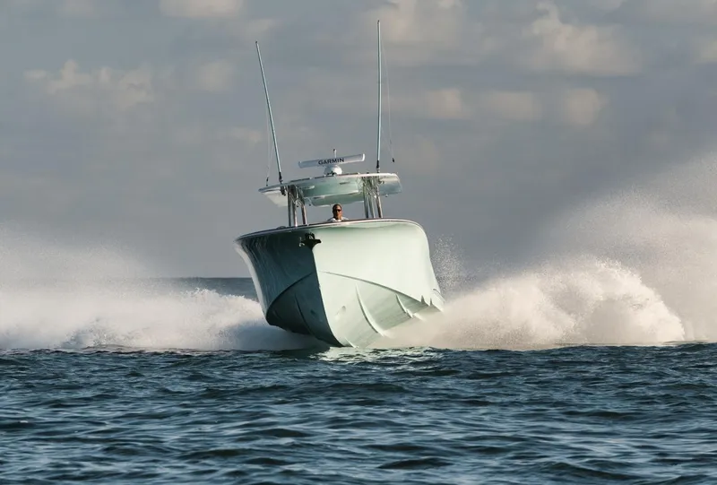 Slide: The Image of 2025 Mag Bay 43 CC boat cruising on open water. - 3