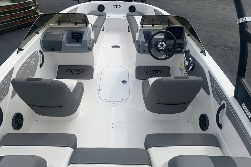 Slide: The Image of 2025 Tahoe T21 boat interior with dual consoles, steering wheel, and seating. - 5