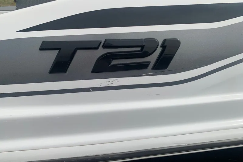 Slide: The Image of 2025 Tahoe T21 boat logo on a sleek white and gray surface. - 9