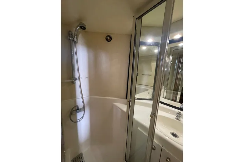 Slide: The Image of Bathroom interior of 1995 Bayliner 4788 Pilot House Motoryacht, featuring shower and sink. - 28