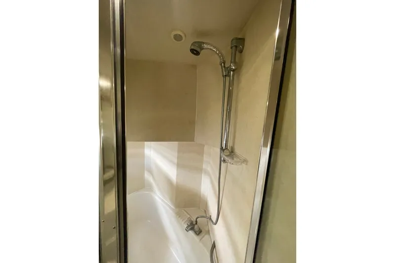 Slide: The Image of Shower area in 1995 Bayliner 4788 Pilot House Motoryacht, featuring modern fixtures. - 33