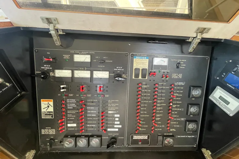Slide: The Image of Control panel of a 1995 Bayliner 4788 Pilot House Motoryacht, featuring various switches and gauges. - 23