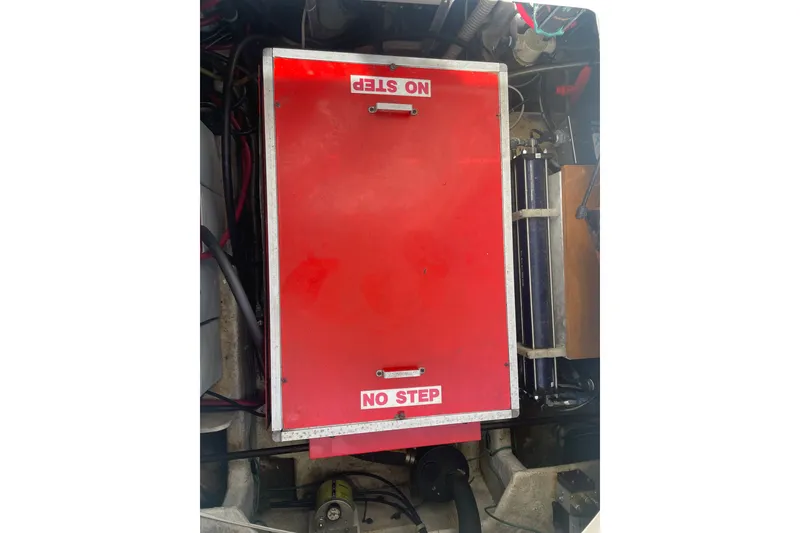 Slide: The Image of Engine compartment of 1995 Bayliner 4788 Pilot House Motoryacht with red "No Step" cover. - 44