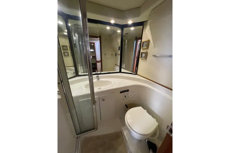 Slide: The Image of Bathroom interior of 1995 Bayliner 4788 Pilot House Motoryacht, featuring sink and toilet. - 31